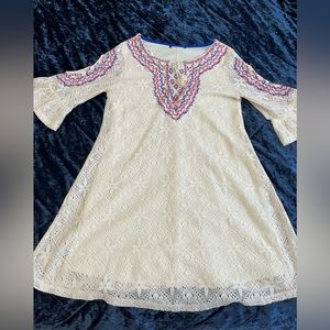 Pretty hippie chic- cottage-core style embroidered accents.